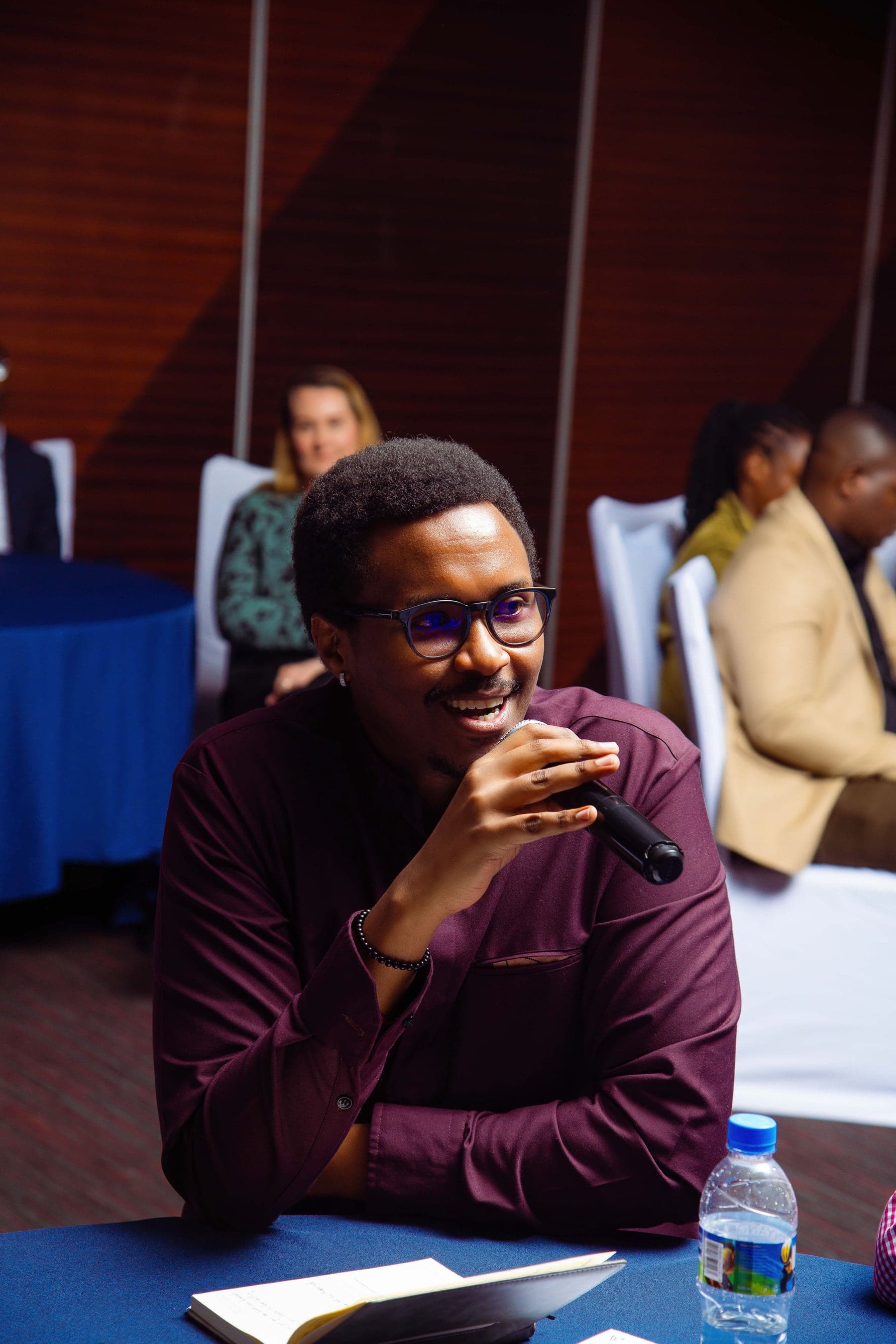 Bruce Mugwaneza speaking during a professional session