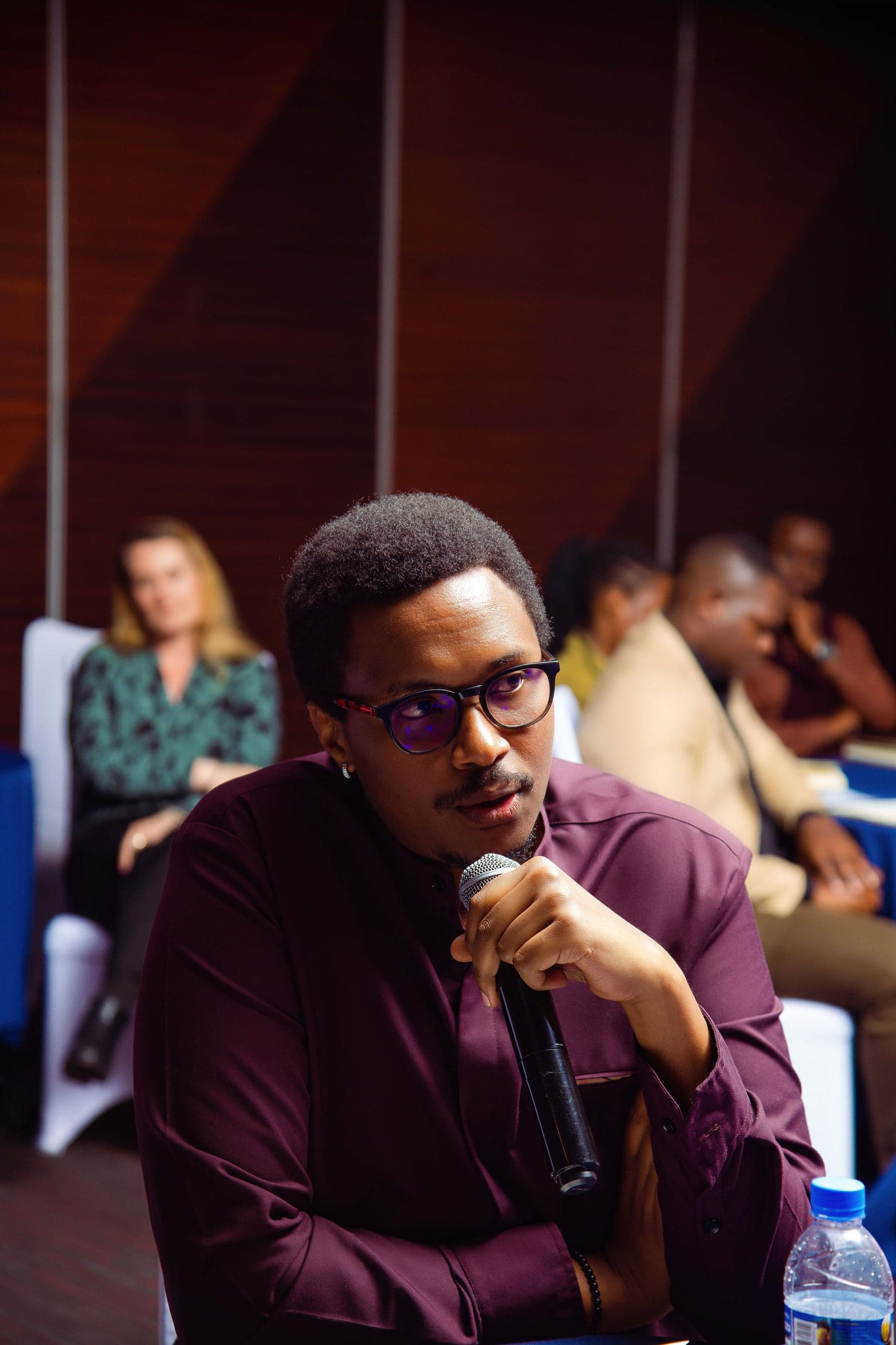Bruce Mugwaneza listening during a professional discussion